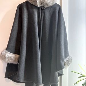 Grey fleece cape, faux fur sleeve and neck trim.  Neck Button closure. One size